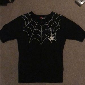 Knitted top with spiderweb design
